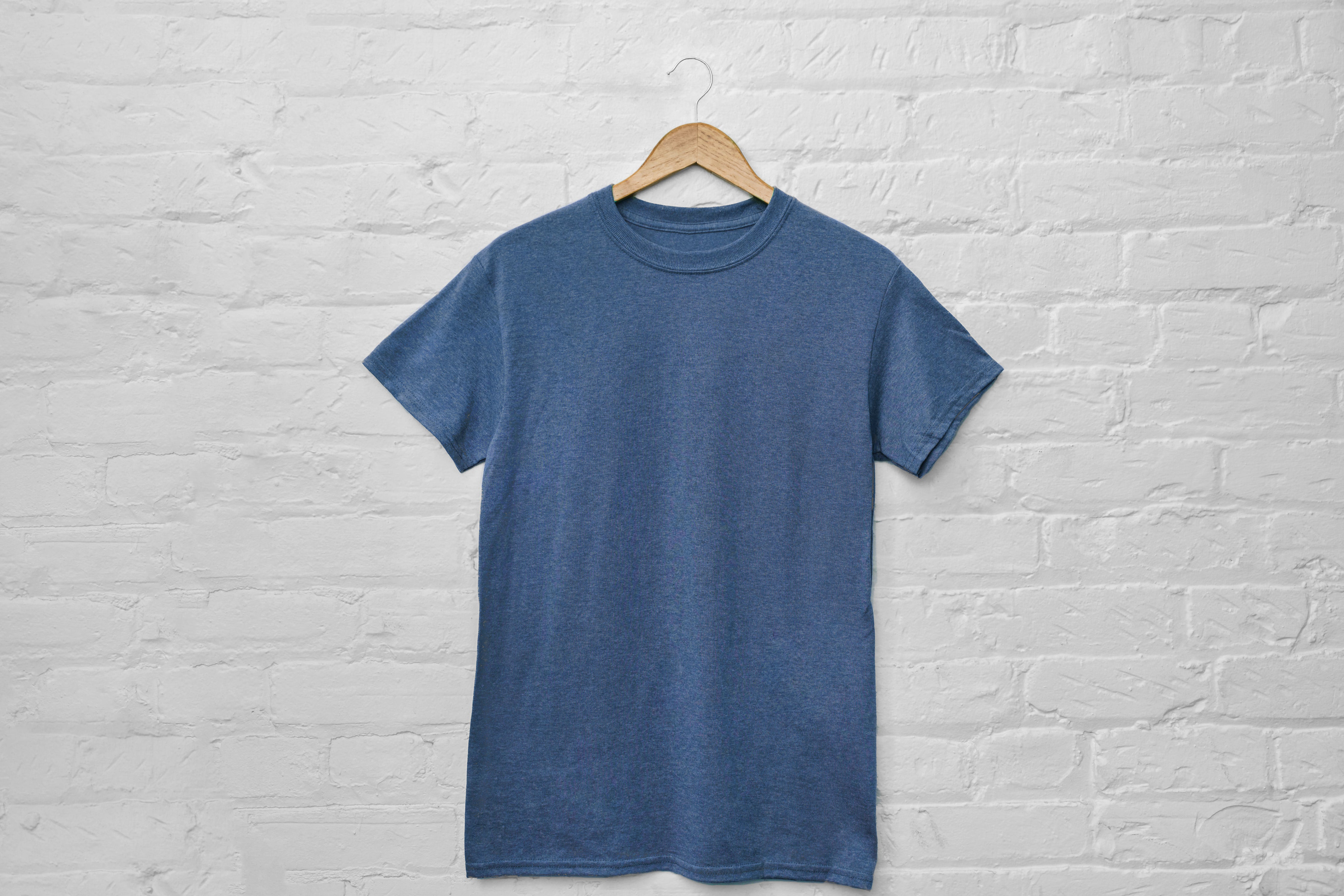 Grey-blue cotton T-shirt on a coat hanger, large image.