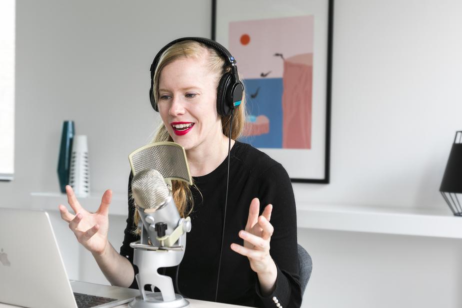 An enthusiastic woman with headphones.